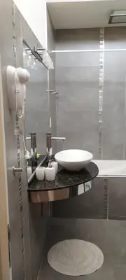 a bathroom with a sink and a bath tub at Alma Dulce in Almafuerte