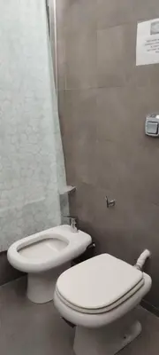 a bathroom with a toilet and a bidet at Alma Dulce in Almafuerte