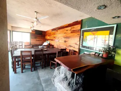a dining room with a table and some chairs at Cabañas De La Vertiente in La Bolsa