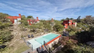 an aerial view of a house with a swimming pool at Cabañas De La Vertiente in La Bolsa