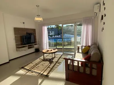 a living room with a couch and a table at Venetto Village in Villa Parque Siquiman