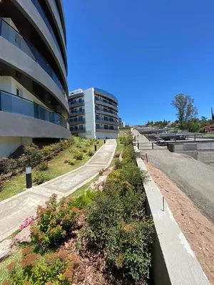 an empty road in front of a building at Venetto Village in Villa Parque Siquiman