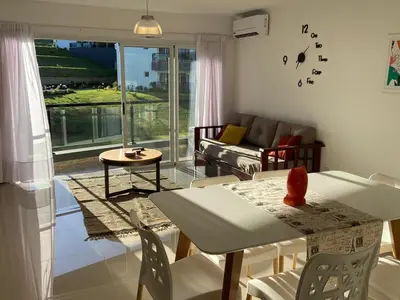 a living room with a couch and a table at Venetto Village in Villa Parque Siquiman