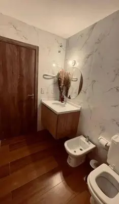 a bathroom with a sink and a toilet at Depto Villa Carlos Paz in Villa Carlos Paz