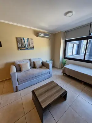 a living room with a couch and a table at Departamento VCP Costanera in Villa Carlos Paz