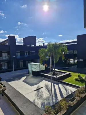 a view of the courtyard of a building at Departamento VCP Costanera in Villa Carlos Paz