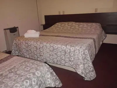 a hotel room with two beds in a room at Hotel Las Vegas in Villa Carlos Paz