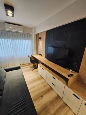 a living room with a large flat screen tv at Departamento tranquilo y luminoso en Nva Cba SS7 in Cordoba