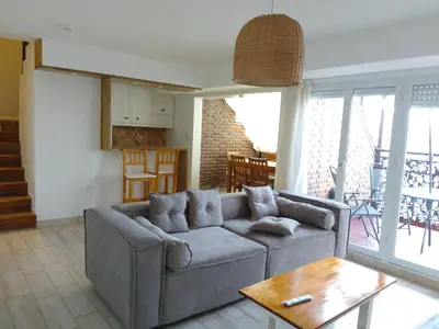 a living room with a couch and a table at duplex13b in Cordoba