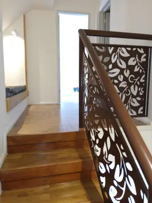 a staircase with a black and white wrought iron railing at duplex13b in Cordoba