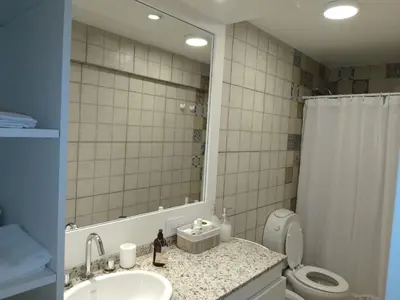 a bathroom with a sink and a toilet and a mirror at duplex13b in Cordoba