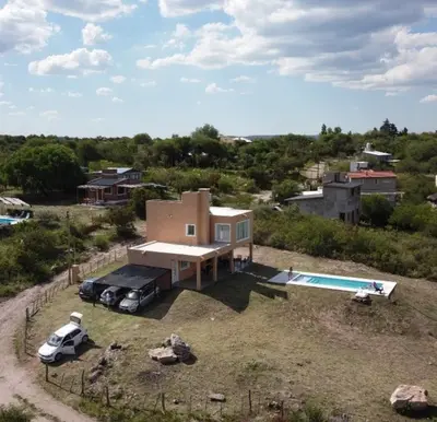 an aerial view of a house with a truck and a pool at Traslavista alojamiento de ensueño in Villa de Las Rosas