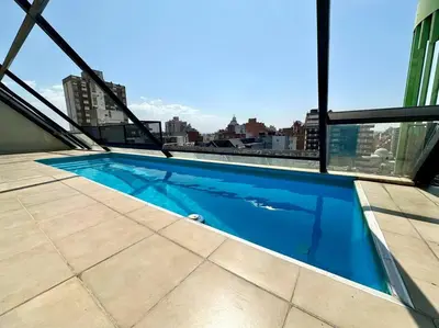 a swimming pool on the roof of a building at Departamento para 6 personas in Cordoba