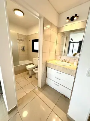 a bathroom with a toilet and a sink at Departamento para 6 personas in Cordoba
