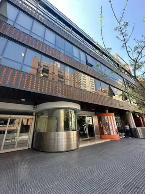 a building with a revolving door in front of it at Departamento para 6 personas in Cordoba