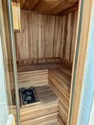 an inside of a wooden sauna with a wooden floor at Departamento para 6 personas in Cordoba