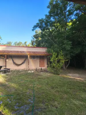a house with a yard in front of it at Dormis Clave de Sol in Villa Ciudad Parque