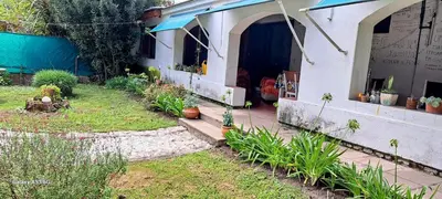 a house with a garden with plants in the yard at CASA de Campo EL LULY in La Bolsa