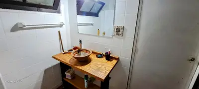 a bathroom with a wooden sink and a mirror at CASA de Campo EL LULY in La Bolsa
