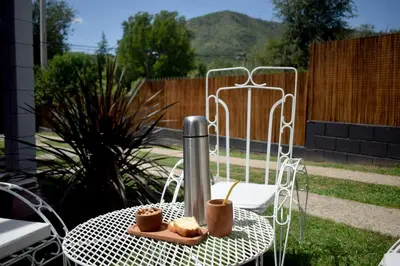 a table with two cups of coffee on it at El Remanso in Villa Independencia
