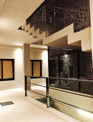 a staircase in a building with a wall of windows at ARECAS Carlos Paz in Villa Carlos Paz