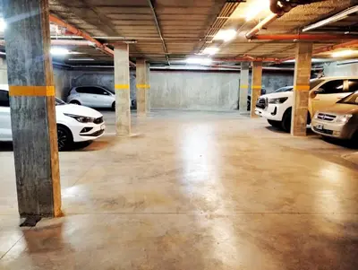 a large parking garage with cars parked in it at ARECAS Carlos Paz in Villa Carlos Paz