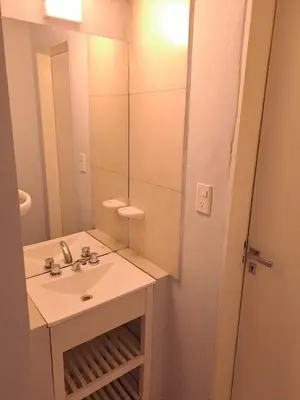 a bathroom with a sink and a mirror at Baumhaus in Villa Anizacate