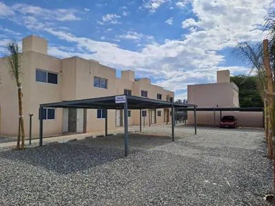 a large black canopy in front of a building at Baumhaus in Villa Anizacate