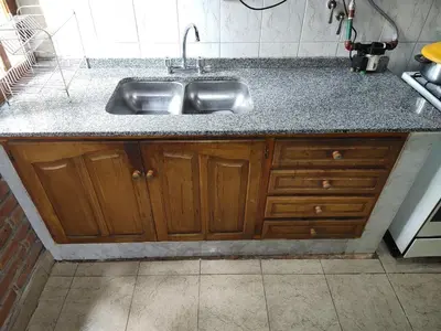 a kitchen counter with a stainless steel sink at AMABLEs in Salsacate