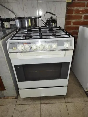 a white stove with a pot on top of it at AMABLEs in Salsacate