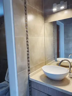 a bathroom with a white sink and a mirror at Apart de Sierras in Nono