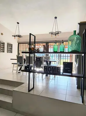 a room with a table with a home sign on it at Casa Privada Carlos Paz con piscina a dos cuadras del rio in Villa Carlos Paz