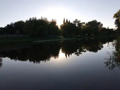 a river with the reflection of trees in the water at Amables 2 in Salsacate