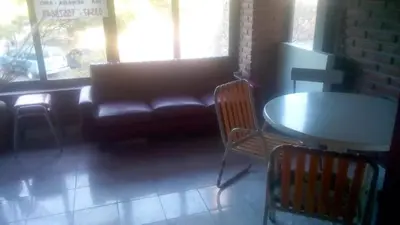 a living room with a couch and a table and chairs at Amables 2 in Salsacate