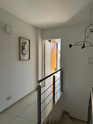 a staircase in a white room with a window at Buen Pastor Design in Cordoba