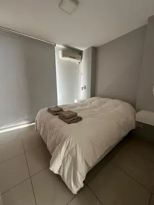 a bedroom with a bed with towels on it at Buen Pastor Design in Cordoba
