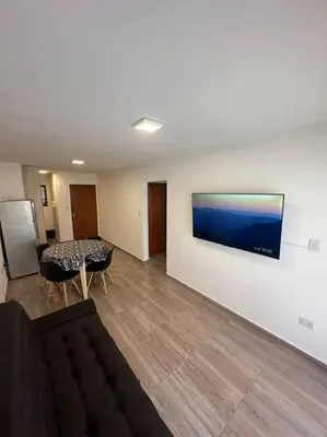 a living room with a couch and a table at Rondeau Suite in Cordoba