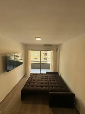 a living room with a couch in a room at Rondeau Suite in Cordoba