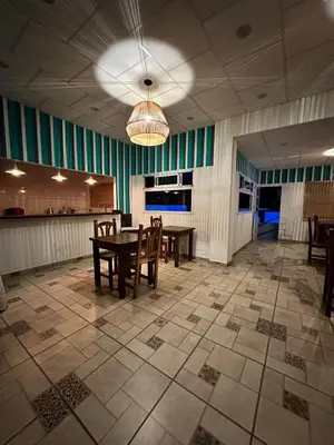 a dining room with a table and chairs in it at HueneyRuca in Mina Clavero