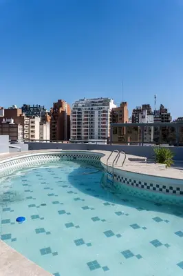 a large swimming pool on the roof of a building at Departamento 114 - Edificio VILAUT by INMOVE Temporarios in Cordoba