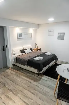 a bedroom with a large bed in a room at Departamento Glamour 203 - Edificio VILAUT by INMOVE Temporarios in Cordoba