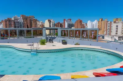 a large swimming pool on the roof of a building at Departamento 216 - Edificio VILAUT by INMOVE Temporarios in Cordoba