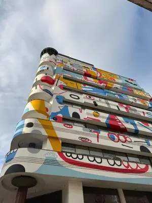 a tall building with many different coloredidents on it at Departamento 216 - Edificio VILAUT by INMOVE Temporarios in Cordoba