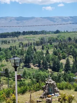 a view of a field with a street light at Complejo Terrazas al Champaqui in Villa Yacanto