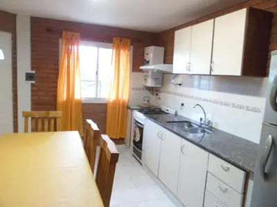 a kitchen with a sink and a counter top at Altos del Plata in Villa Carlos Paz