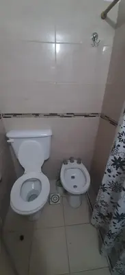 a small bathroom with a toilet and a bidet at Depto Morandini in Villa Carlos Paz