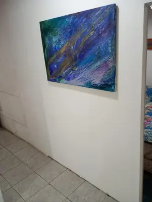 a painting hanging on a wall in a room at El Dpto de Gabicito III in Cordoba