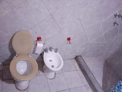 a bathroom with a toilet and a bidet at El Dpto de Gabicito III in Cordoba
