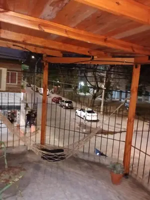 a cage with cars parked in a parking lot at El Dpto de Gabicito III in Cordoba