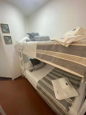 a couple of bunk beds in a room at Dpto confortable, super equipado para 4 huéspedes y cerca de todo! in Cordoba